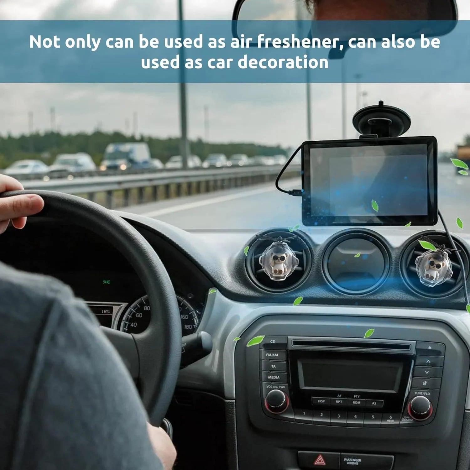 Bear Pilot Car Air Freshener with a Propeller Diffuser used as a car decoration on a car dashboar