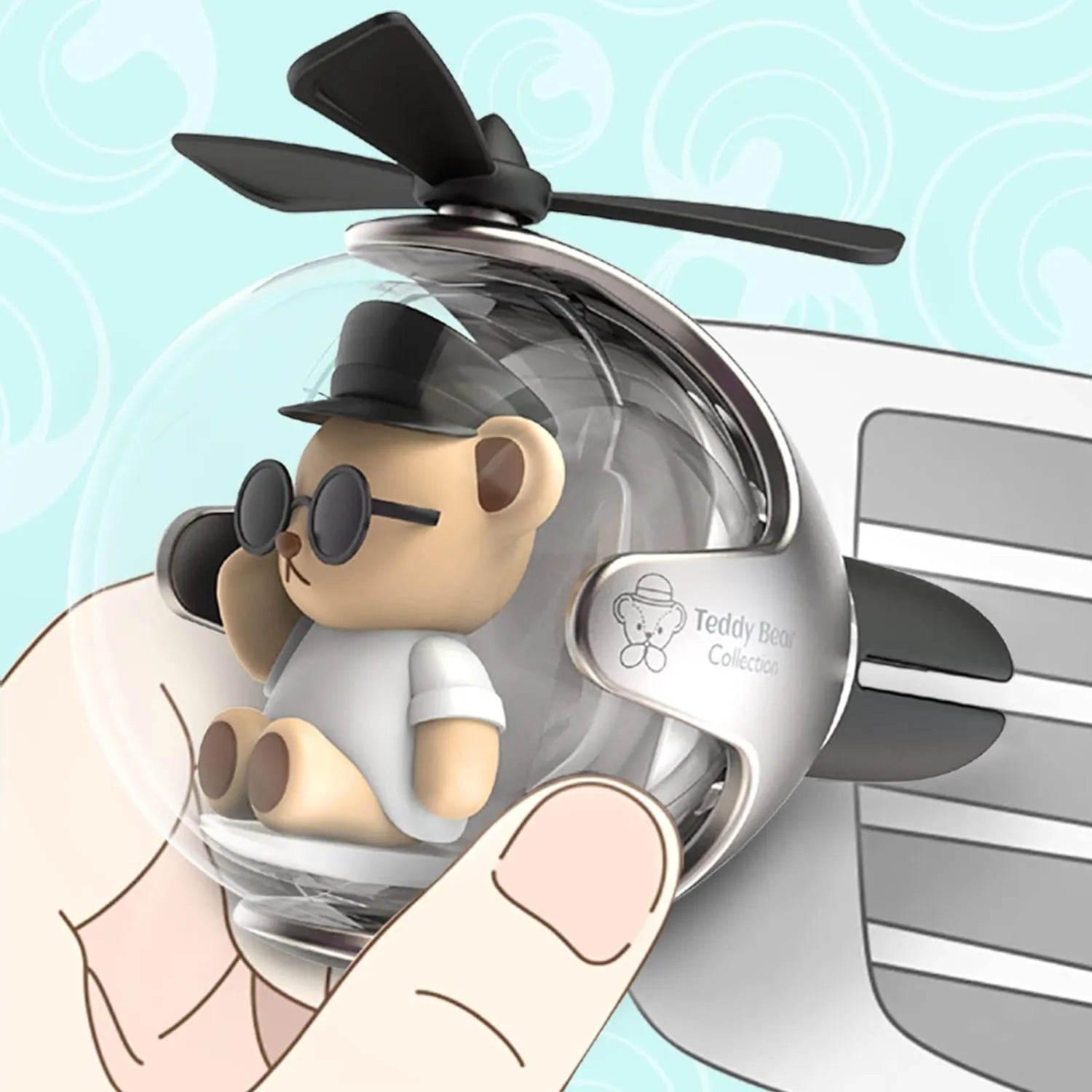 Close-up of Bear Pilot Car Air Freshener with a Propeller Diffuser in hand, attached to a car vent