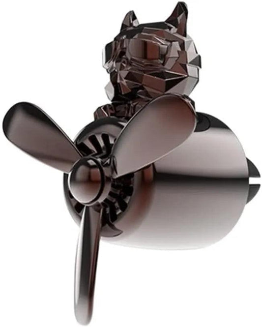 The image shows a car air freshener set featuring a bulldog-shaped air freshener with a propeller design. The bulldog figure is designed to look like a pilot, and the propeller is positioned at the front. The air freshener has a sleek, metallic finish.