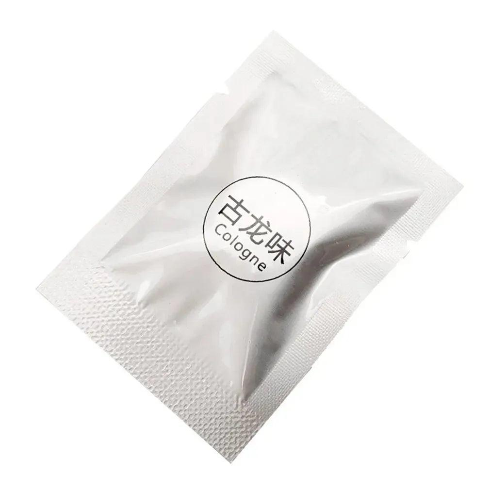 Individually packaged air freshener with a cologne scent in a silver foil packet.