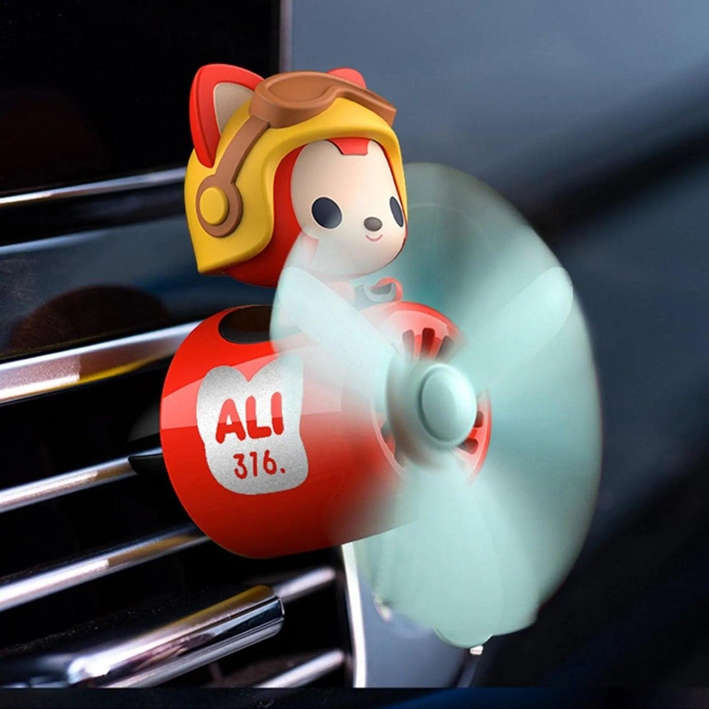 Close-up of Cute Raccoon Pilot Car Air Freshener with a Propeller Diffuser attached to a car vent
