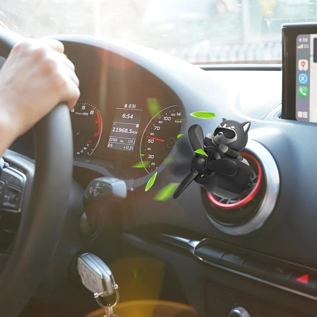 Husky Dog Pilot Car Air Freshener installed on car dashboard vent, providing a refreshing fragrance during a drive.