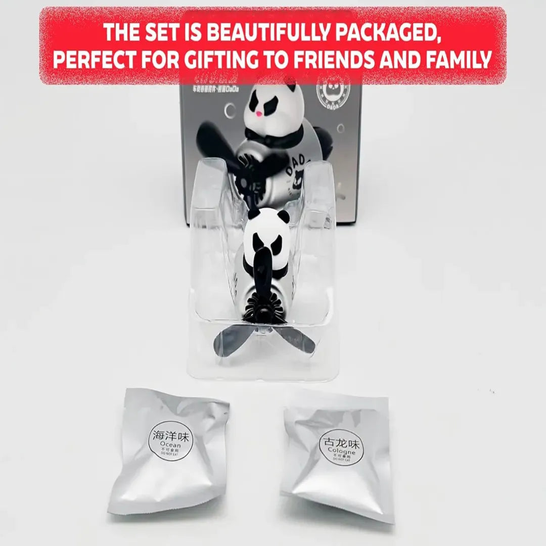 A panda-themed car air freshener attached to the air vent of a car's dashboard. The interior of the car includes a steering wheel and a dashboard with speed and other gauges. The background shows a scenic view outside the car.