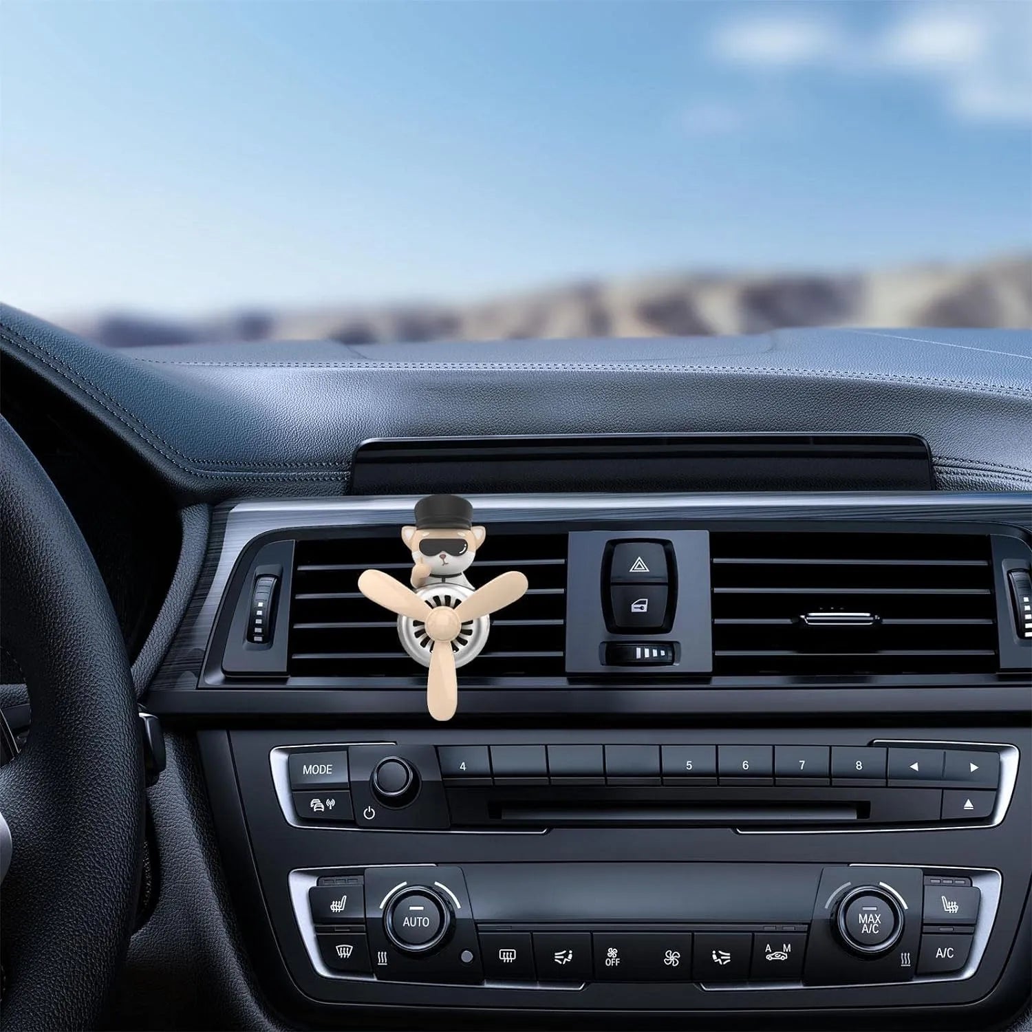 Shiba Inu pilot car air freshener with propeller diffuser placed on a car dashboard air vent, showcasing its use in a vehicle interior.