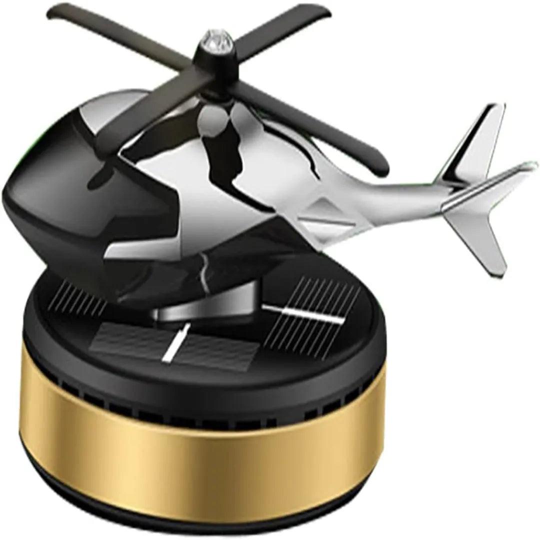 Gold and black solar-powered helicopter propeller car air freshener on a sleek circular base, designed to enhance car interiors with a fresh and stylish fragrance solution.