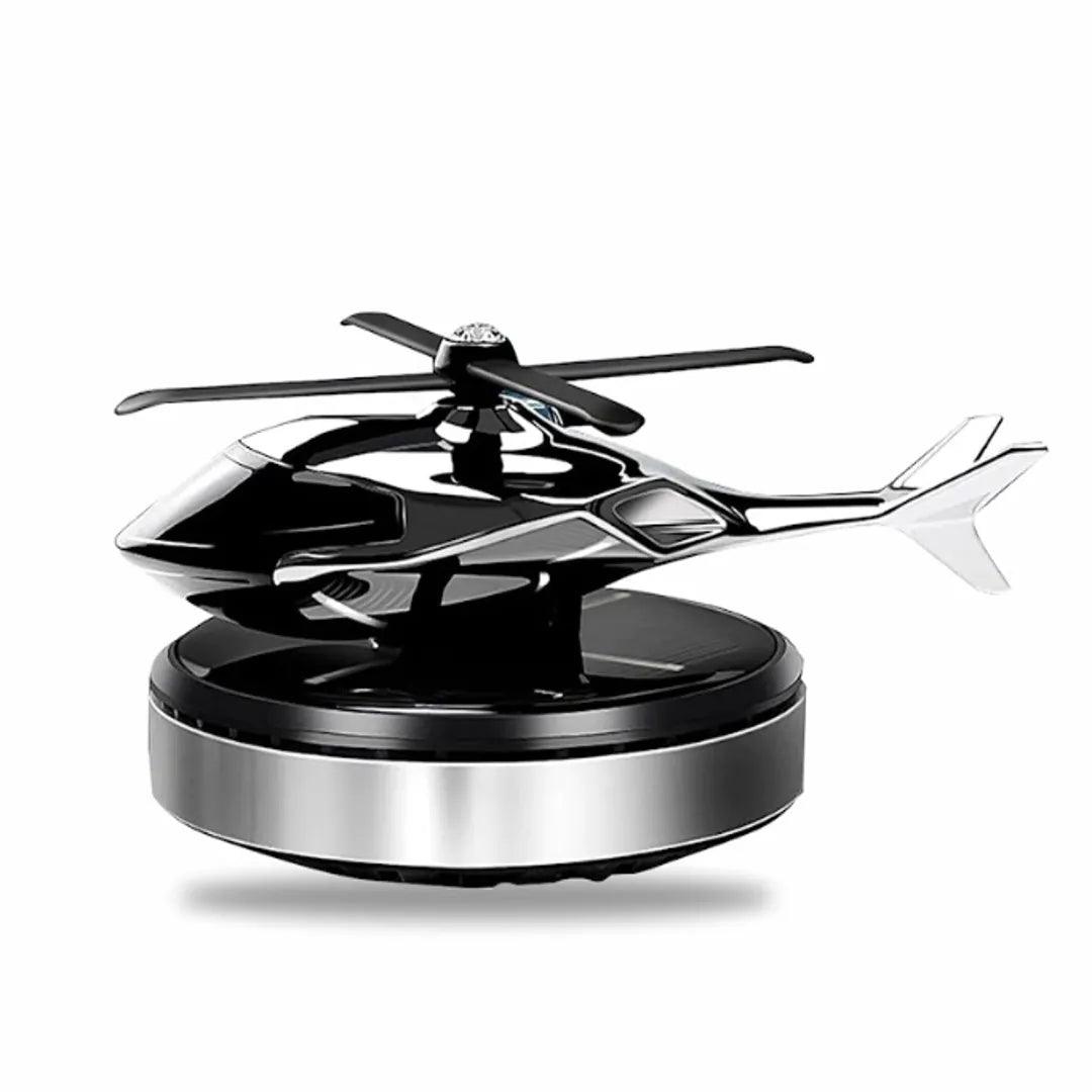 SIlver solar-powered helicopter propeller car air freshener on a silver base, designed for stylish automobile interior decoration and fragrance diffusion.