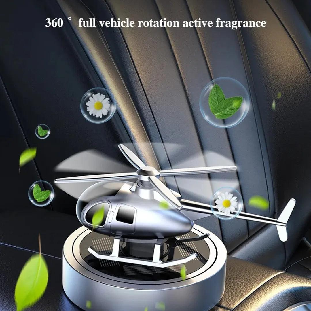 Solar-powered helicopter propeller car air freshener with 360-degree full vehicle rotation, actively spreading fragrance in car interiors.