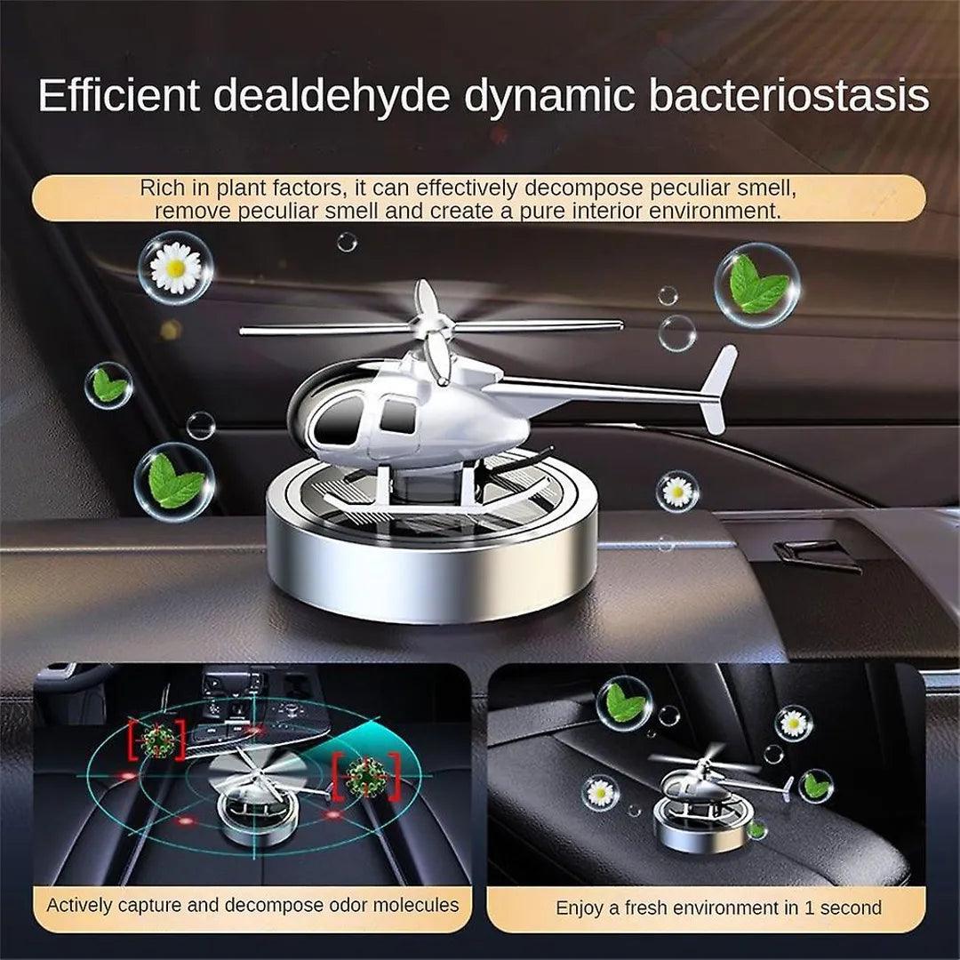 Silver solar-powered helicopter propeller car air freshener with dynamic bacteriostasis technology, efficiently decomposing odors and purifying car interiors.