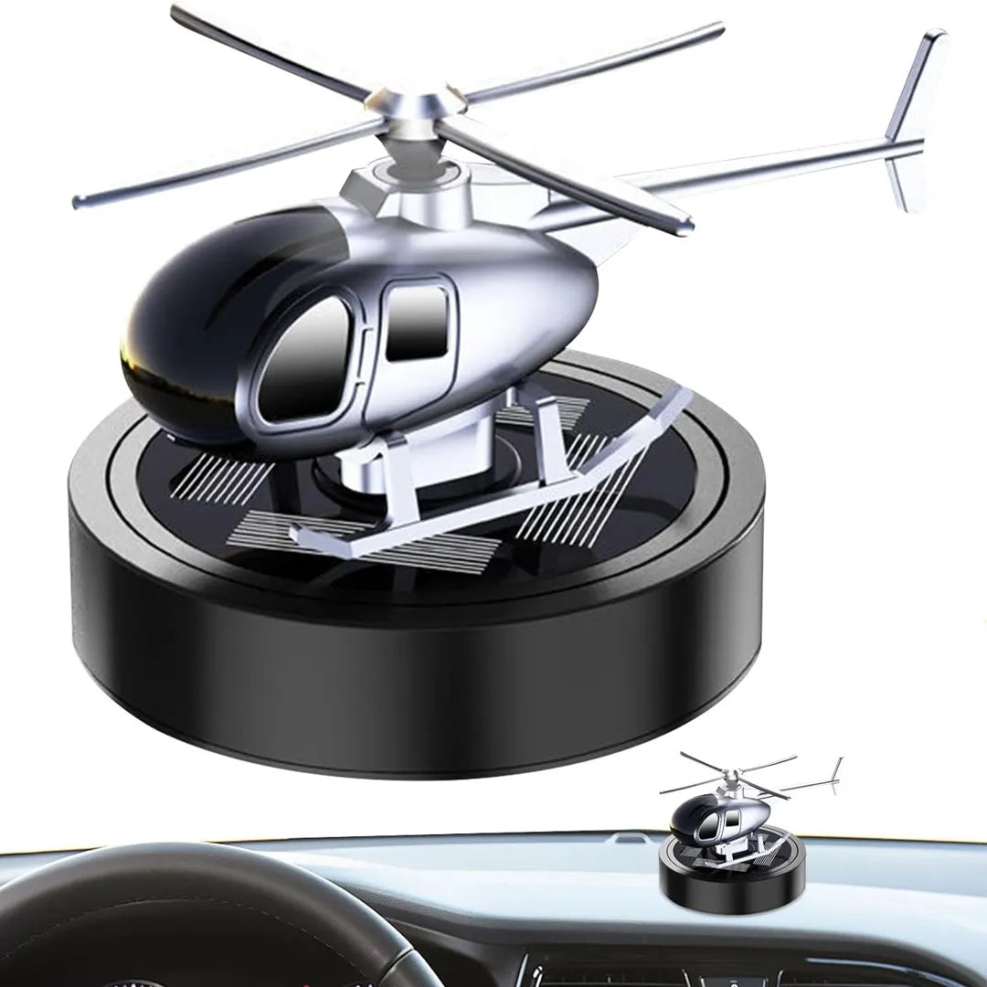 Solar-powered helicopter propeller car air freshener displayed on a car dashboard, offering a modern and stylish fragrance solution for vehicles.
