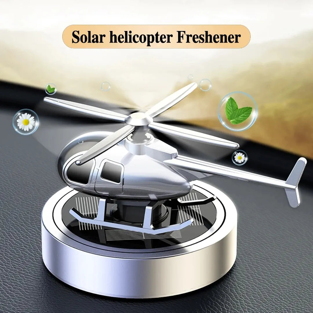 Silver solar-powered helicopter propeller car air freshener, providing a fresh fragrance and stylish design for car interiors.