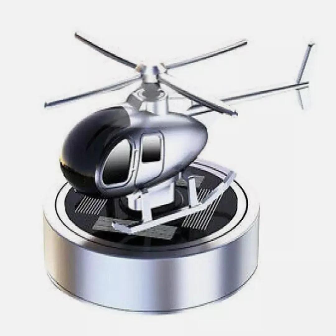 Compact silver solar-powered helicopter propeller car air freshener, providing a stylish and efficient fragrance solution for car interiors.